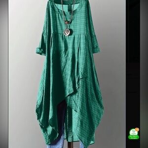 Green asymmetrical dress with black print